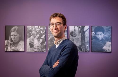 image of Will Schneider standing in front of purple wall