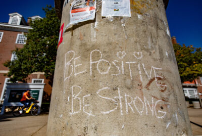 image of message written on pole on Quad