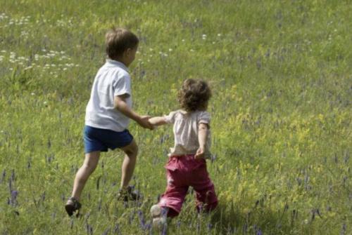 children walking in the grass