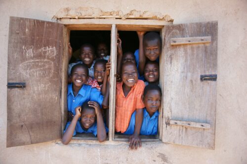 smiling children in Uganda village