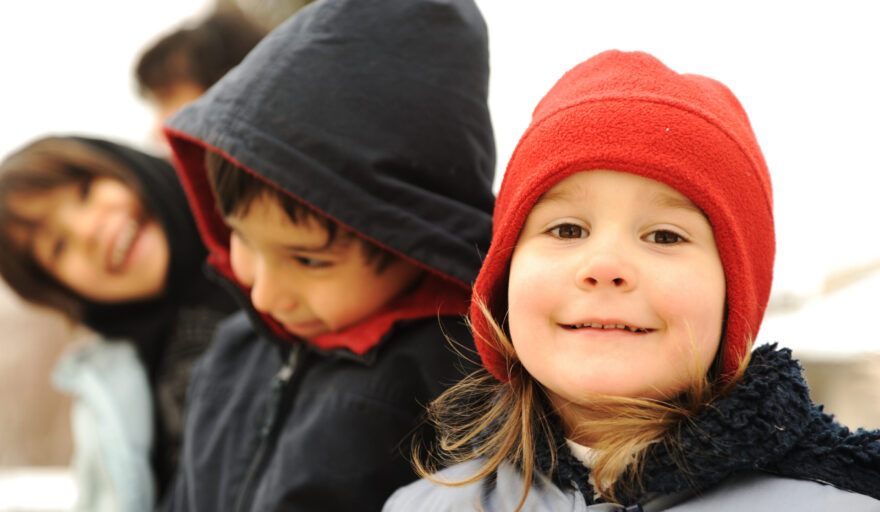 image of happy children in winter clothing