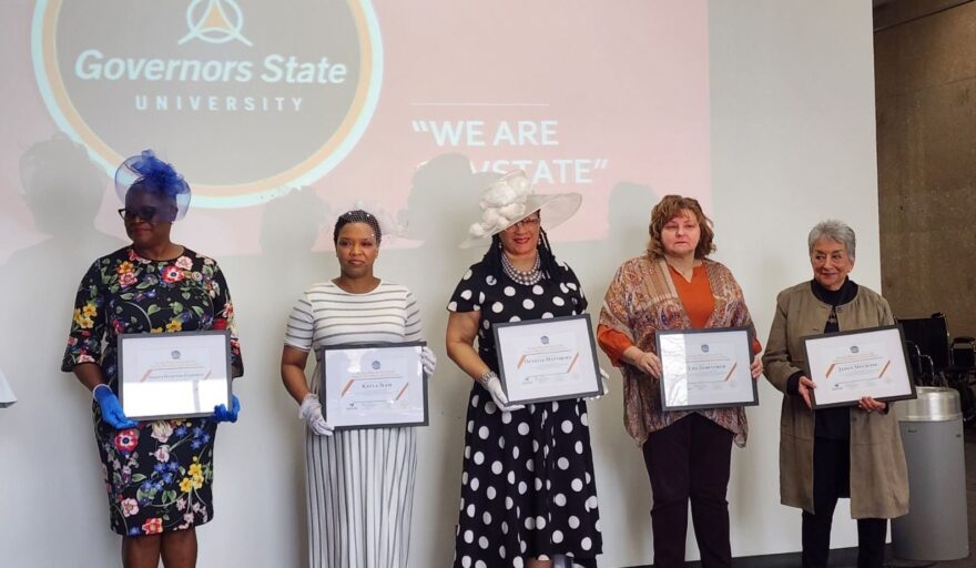 Sharva Hampton-Campbell is standing alongside the other women being honored by the Governers State University