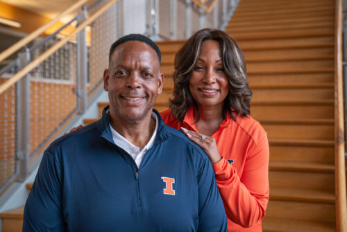 Deryk and Camille Gilmore on stairs at GIES College of Business