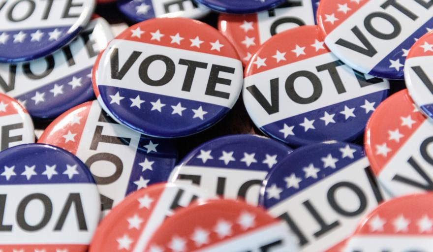 A closeup image of red, white, and blue voting buttons